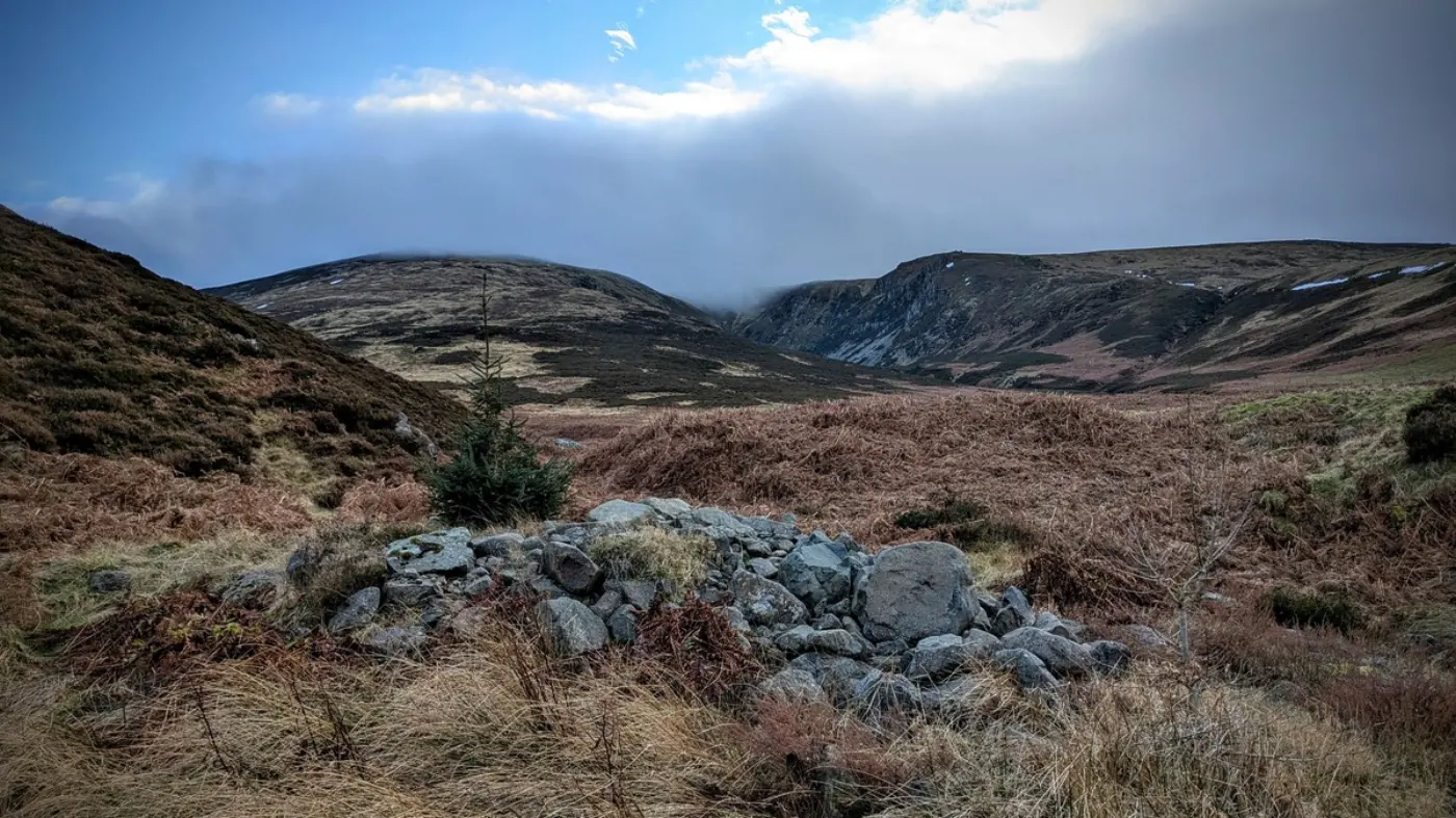 Photograph of The Cheviot with clouds at the top